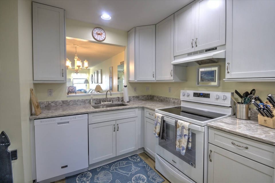 Don't miss out on family time with a view from the kitchen to the living room.
