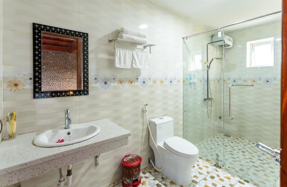 Shower, hair dryer, slippers, towels