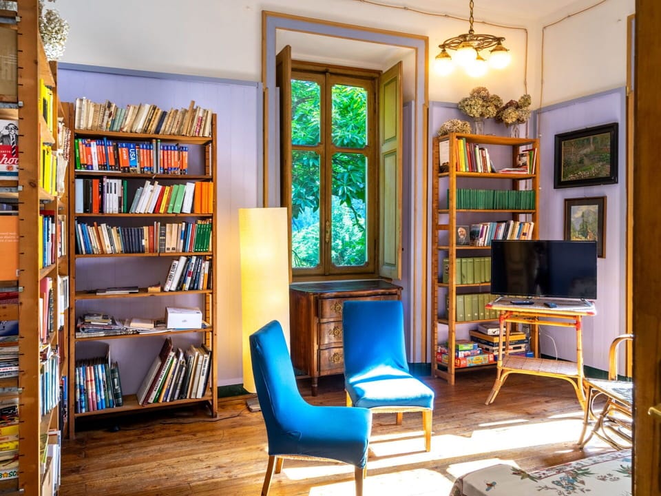 Bookcase, Property, Furniture, Shelf, Picture Frame, Table, Book, Wood, Shelving, Lighting