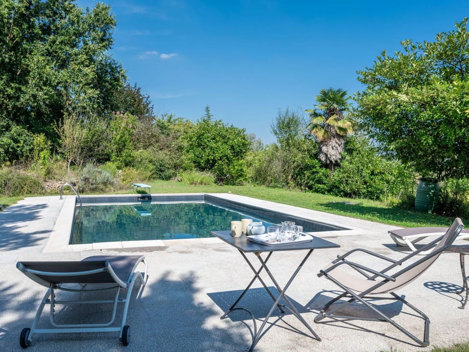 Plant, Plant Community, Sky, Water, Tree, Shade, Outdoor Furniture, Swimming Pool, Grass, Leisure