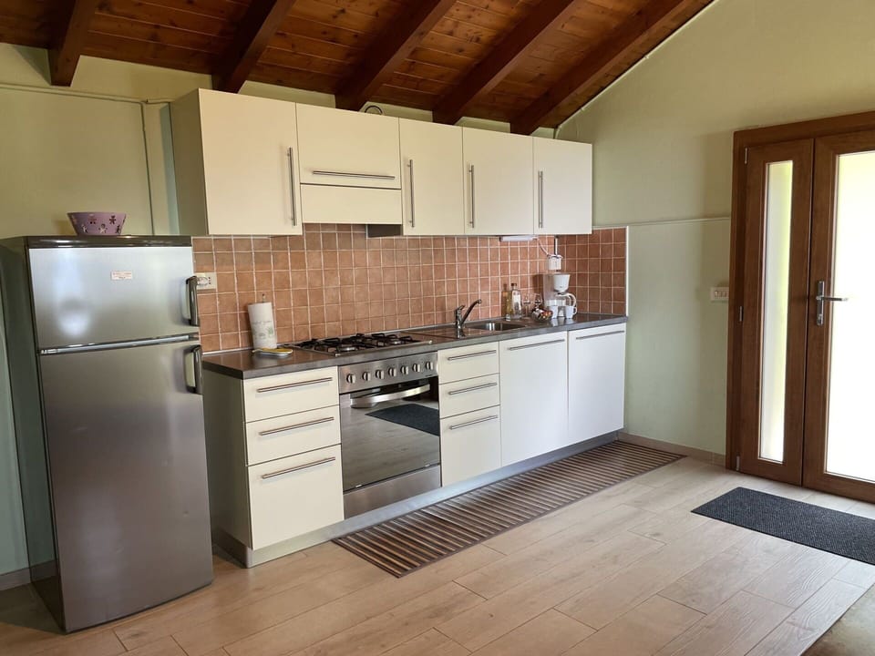 Cabinetry, Countertop, Building, Kitchen Stove, Kitchen, Wood, Kitchen Appliance, Interior Design, Flooring, Floor