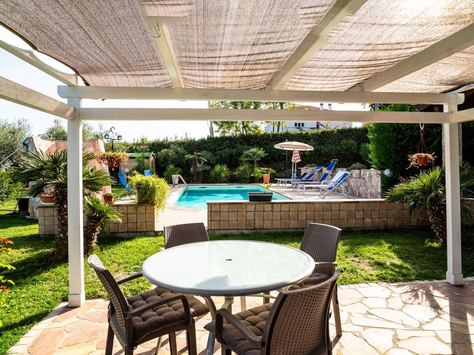 Plant, Furniture, Table, Chair, Shade, Outdoor Furniture, Outdoor Table, Building, Leisure, Real Estate