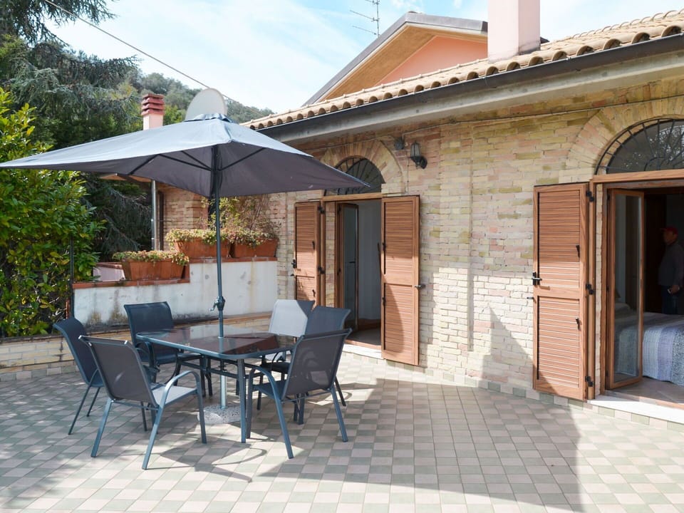 Furniture, Table, Building, Plant, Shade, Window, Door, Chair, Sky, Outdoor Table