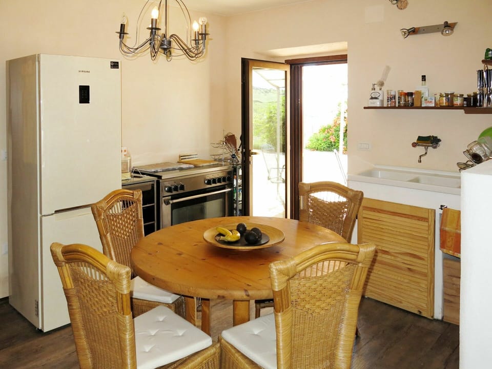 Table, Furniture, Property, Cabinetry, Chair, Countertop, Lighting, Wood, Picture Frame, Floor