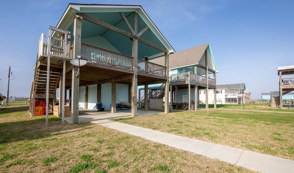House facing the Gulf Intracoastal Waterway with beach views from the deck.

