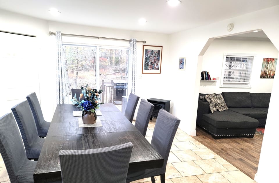 Dining room table and partial view of living room