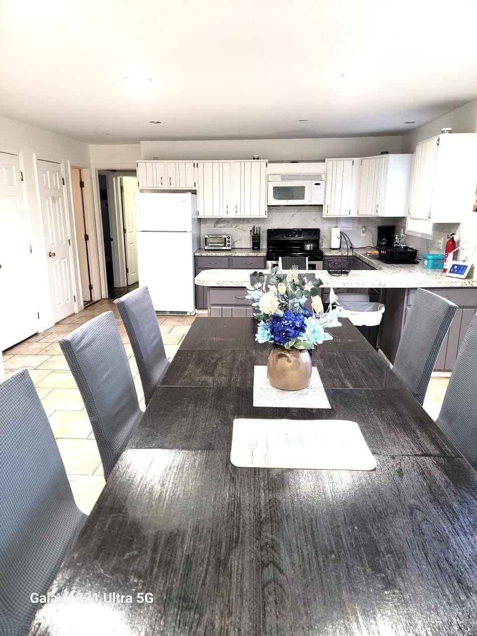 Dining room with a view of the kitchen. 