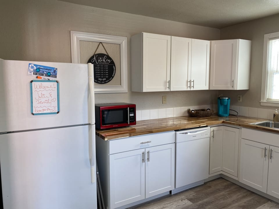 Fridge, dishwasher and microwave in kitchen 