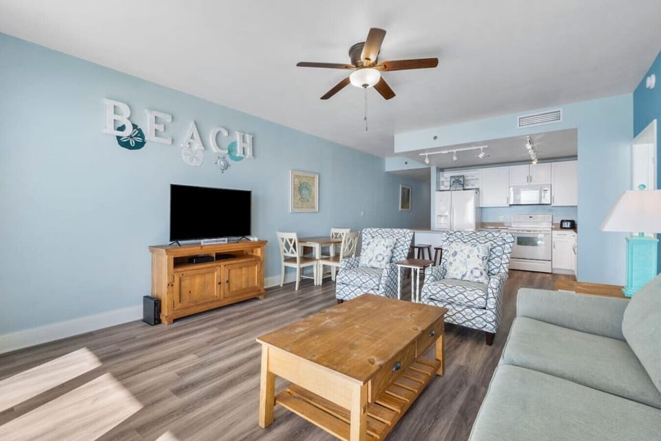 Living Area with Ocean Views, Flat Screen TV, Sleeper Sofa and Private Balcony Access