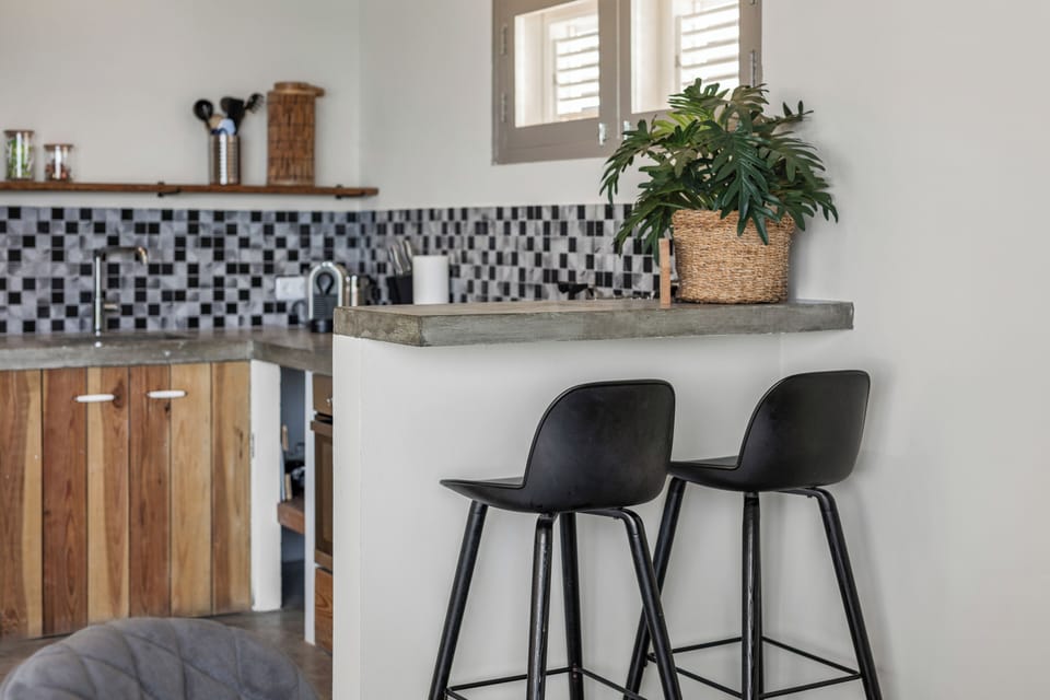 Ocean View Suite | Private kitchen | Full-size fridge, toaster, cleaning supplies