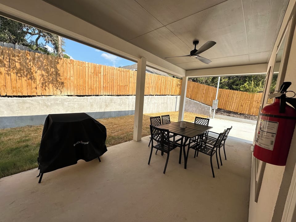 Enjoy an evening on the covered porch, a 43” TV, table for 6 & Blackstone Grill.