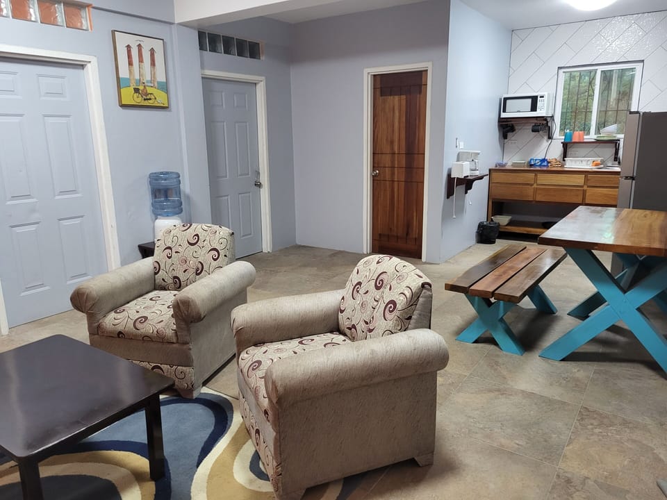 Family Suite | Living area | 32-inch flat-screen TV with digital channels, TV