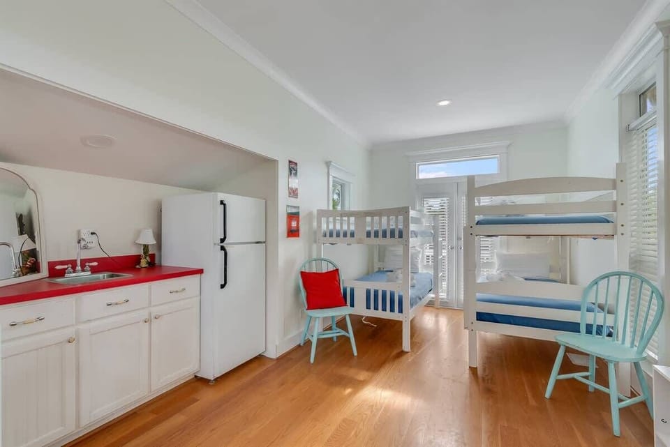 - Spacious bunk room with mini kitchenette, perfect for keeping snacks and drinks nearby - Two twin over twin bunk beds offer space for kids or friends to hang out and recharge - Large windows and French doors let sunlight pour in all day