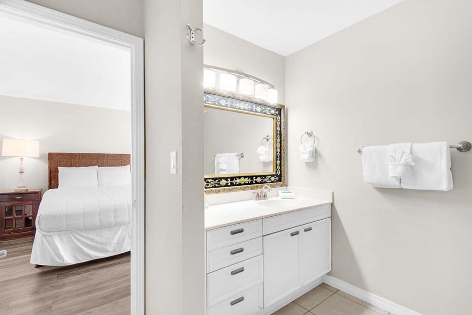 Step into your private ensuite where fresh towels await and elegant details create a spa-like atmosphere for your morning routine.