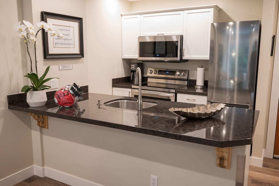 Create a culinary masterpiece in the fully-equipped kitchen.