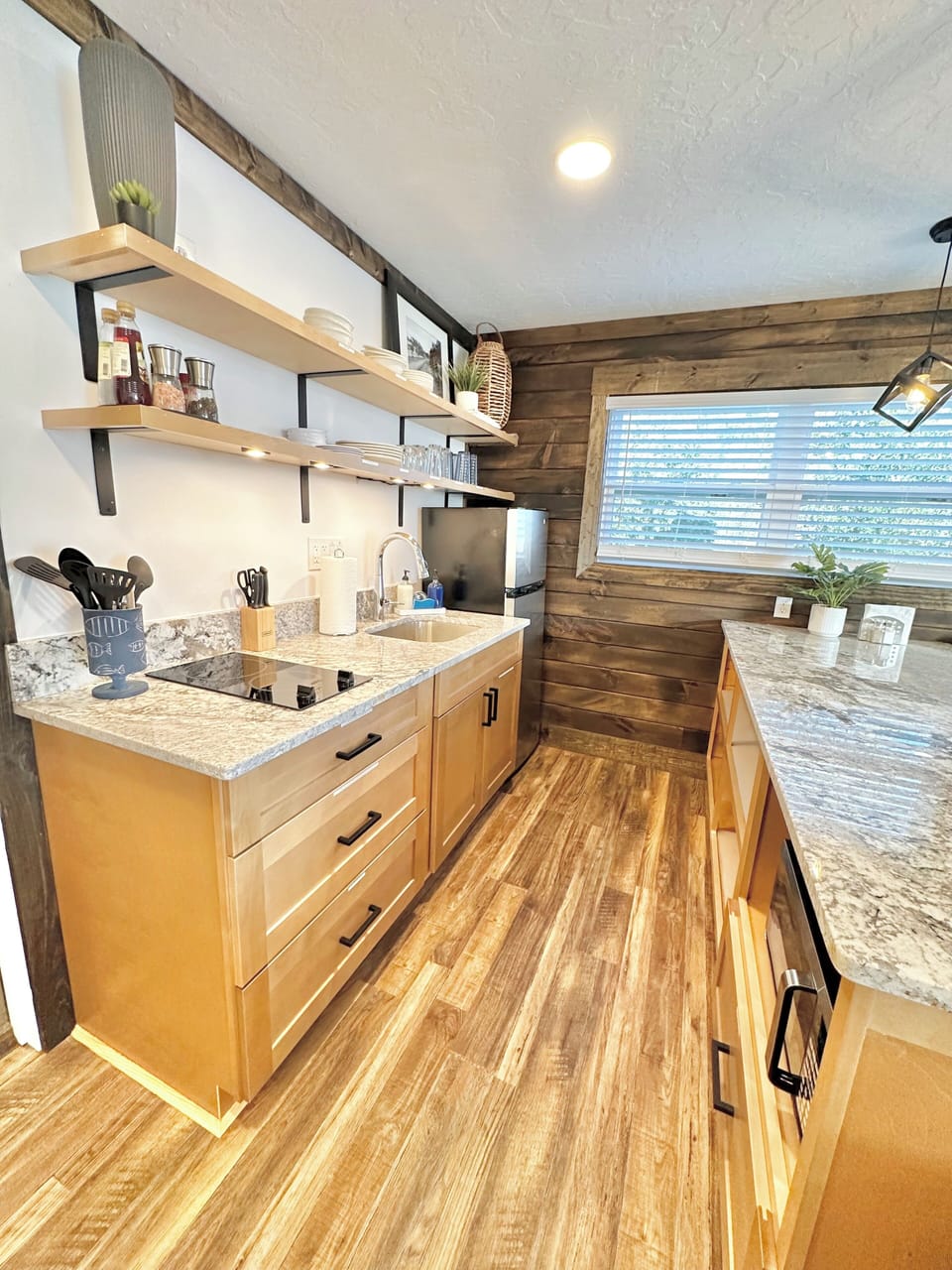 Kitchenette w/ 2 eye stove top, refrigerator/freezer, toaster, & microwave.