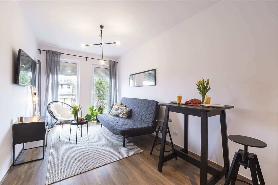 Living room with a comfortable sofa and TV. 