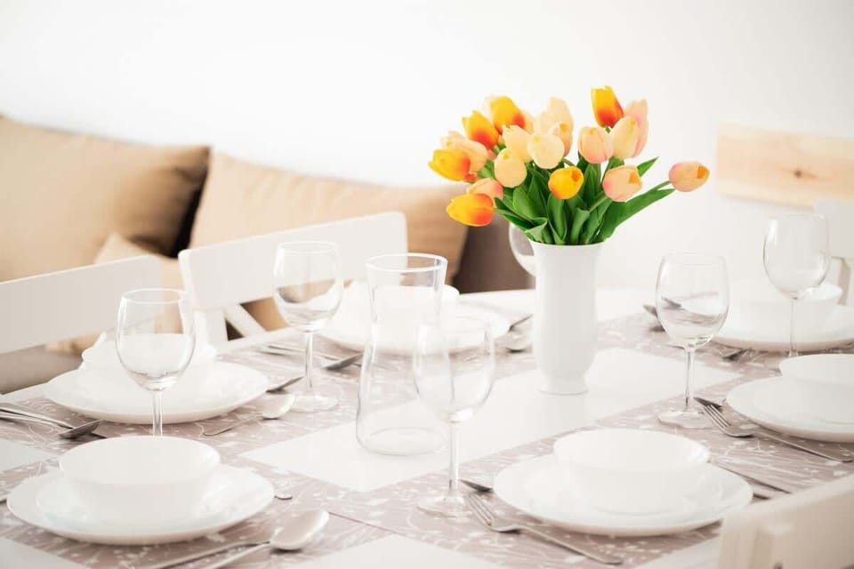 A stylish dining table with chairs, which is ideal for family meals or remote work.