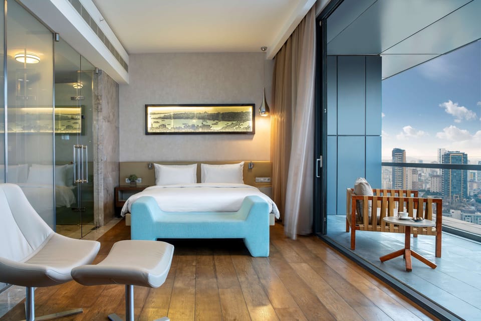 Junior Suite, Terrace, City View | Premium bedding, minibar, in-room safe, individually decorated
