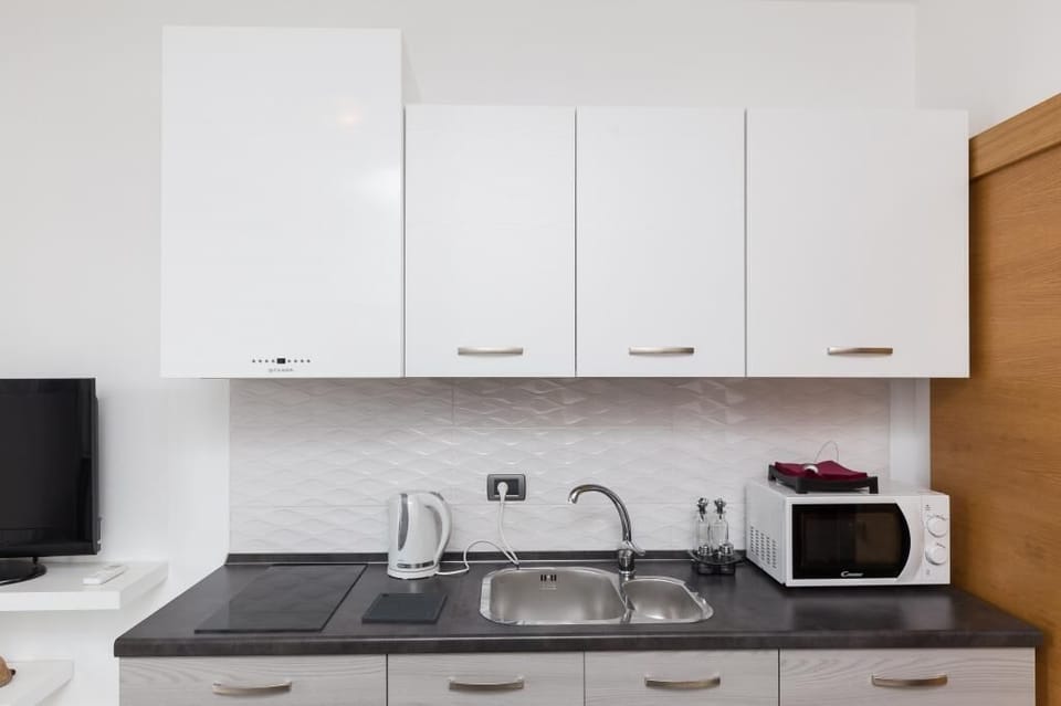 Apartment (One Bedroom Apartment with Terrace) | Private kitchen | Fridge, coffee/tea maker, electric kettle