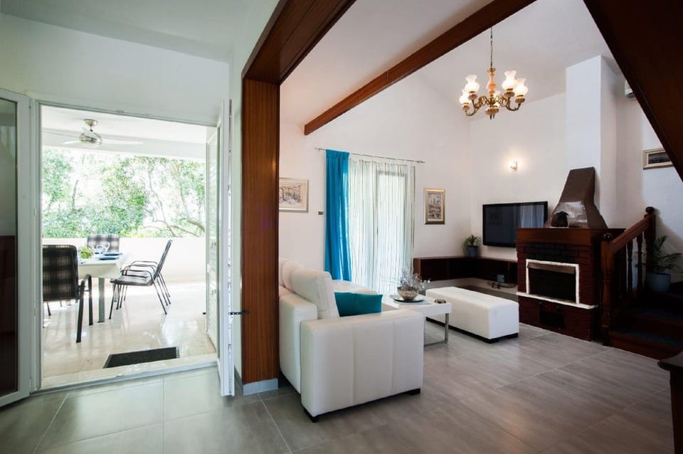 House (Four Bedroom Holiday Home with Pool) | Living room | TV