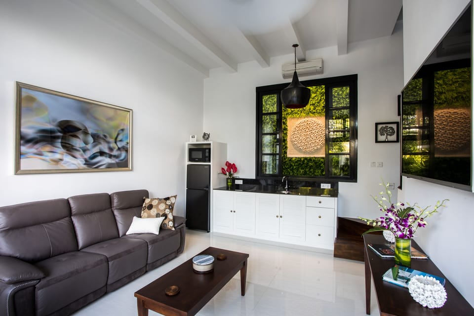 Exclusive Villa, 1 Bedroom | Living area | 40-inch LCD TV with cable channels, TV