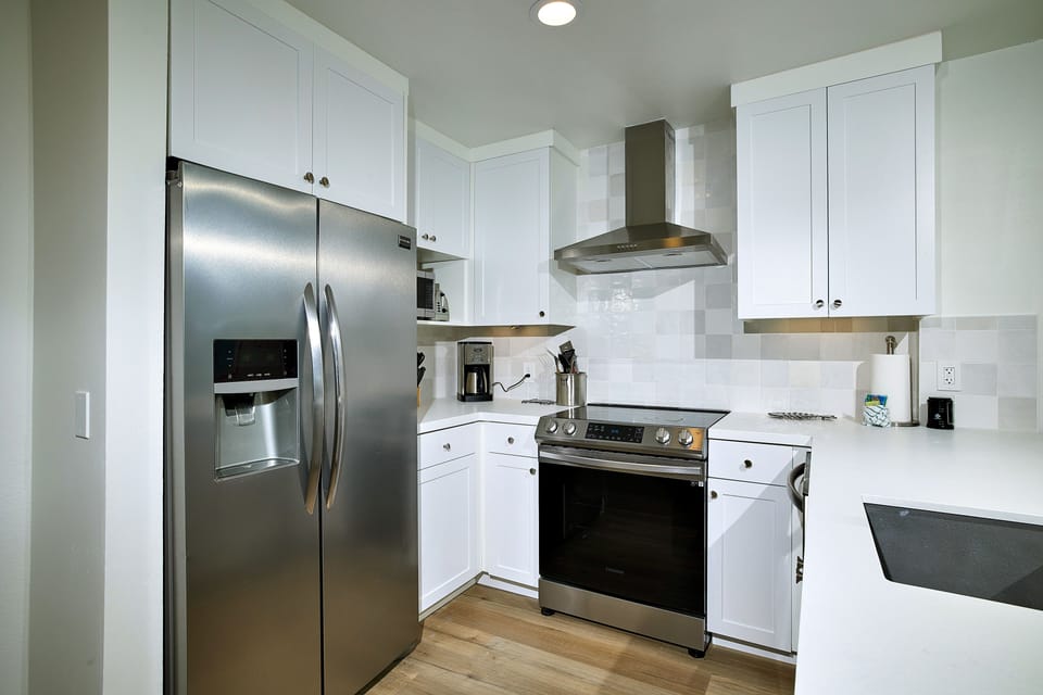 Wood-look floors enhance the decor throughout the condo.