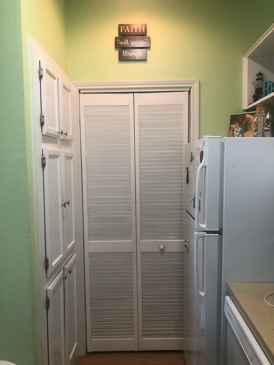Washer and dryer behind the door.