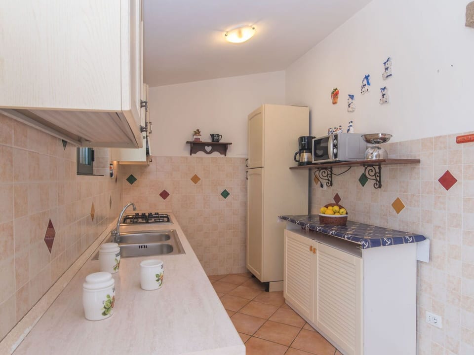 Property, Cabinetry, Wood, Interior Design, Sink, Tap, Countertop, Kitchen Sink, Plumbing Fixture, Floor