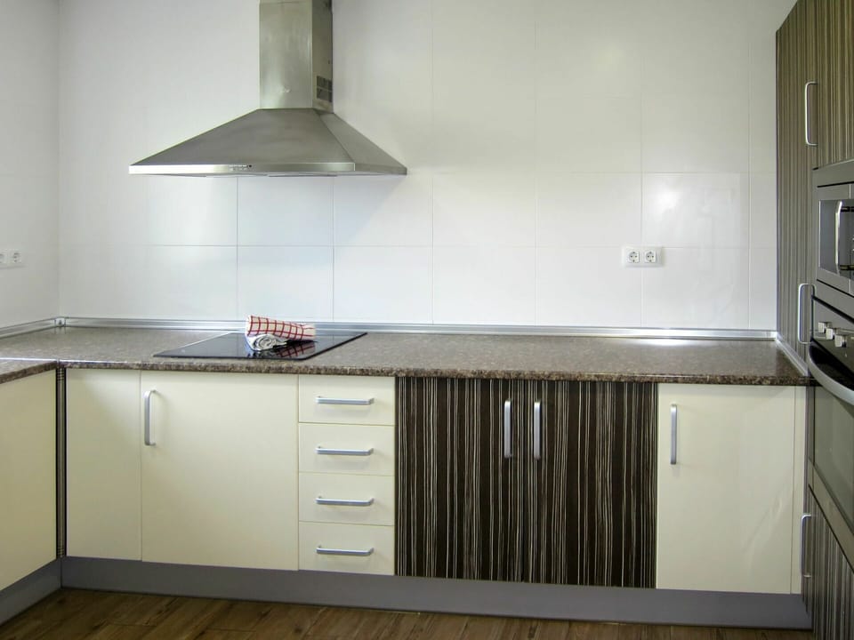 Cabinetry, Countertop, Kitchen Stove, Kitchen Appliance, Building, Kitchen, Home Appliance, Wood, Exhaust Hood, Lighting