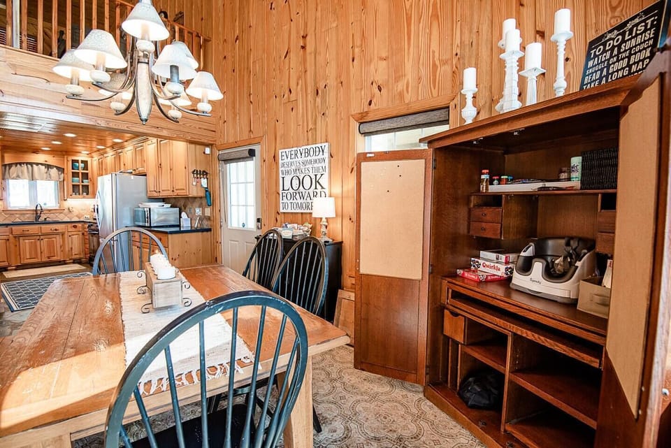 Dining cupboard has portable high chair and games for the family