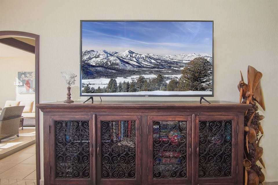 living room with 75" tv, games and books.. All  bedrooms have a tv