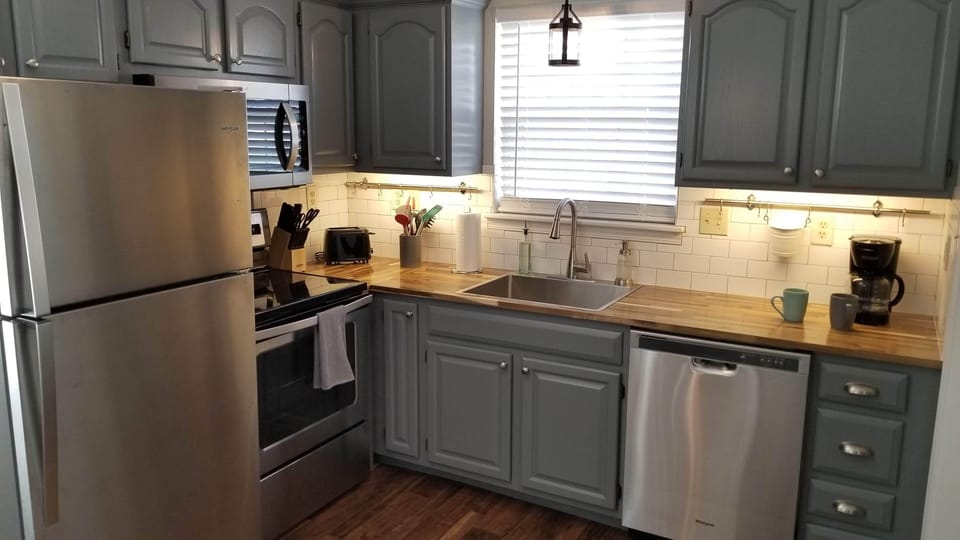 Fully stocked kitchen with coffee maker, toaster