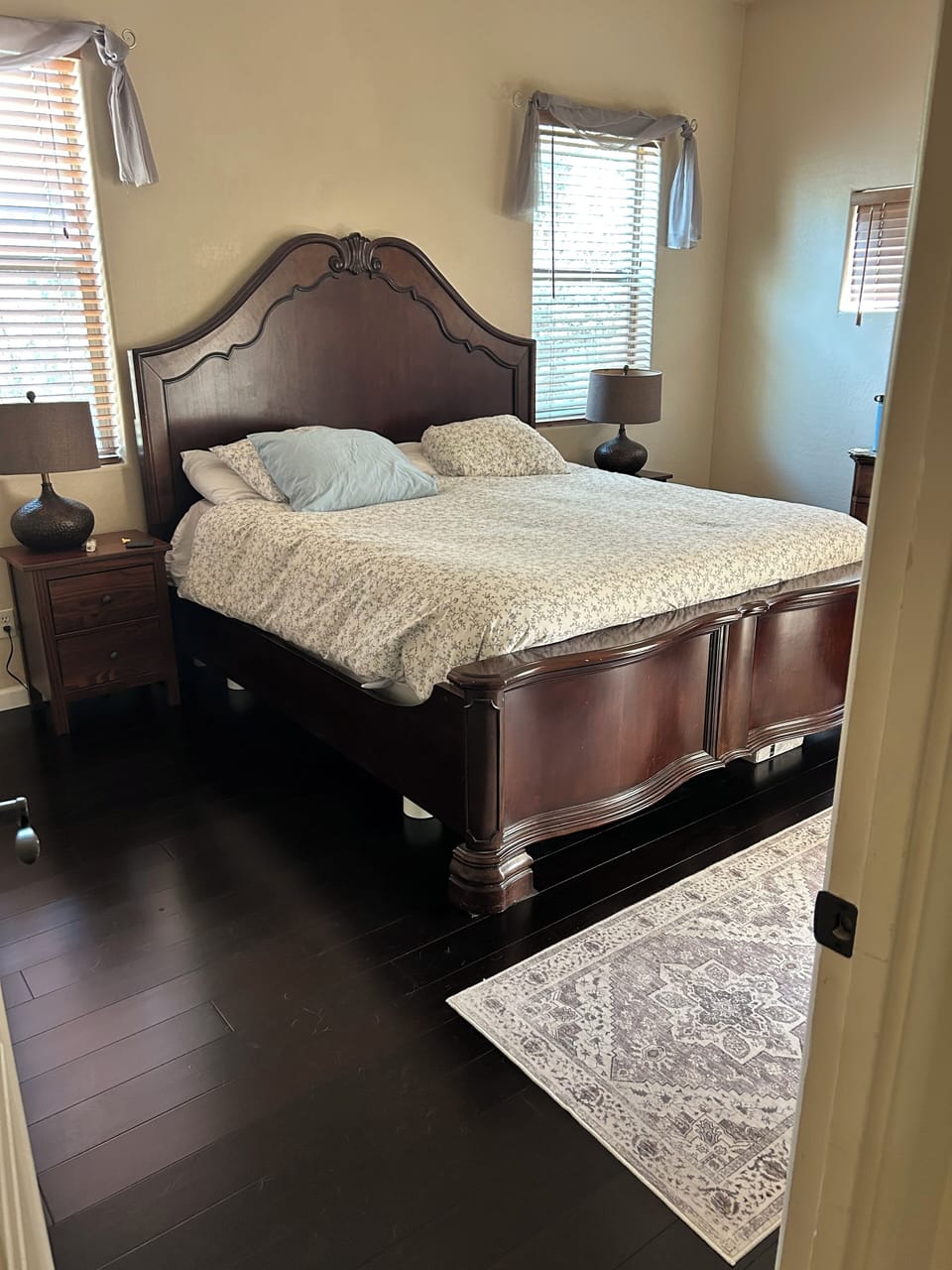 Primary bedroom features brand new wood floors and king bed and new mattress.