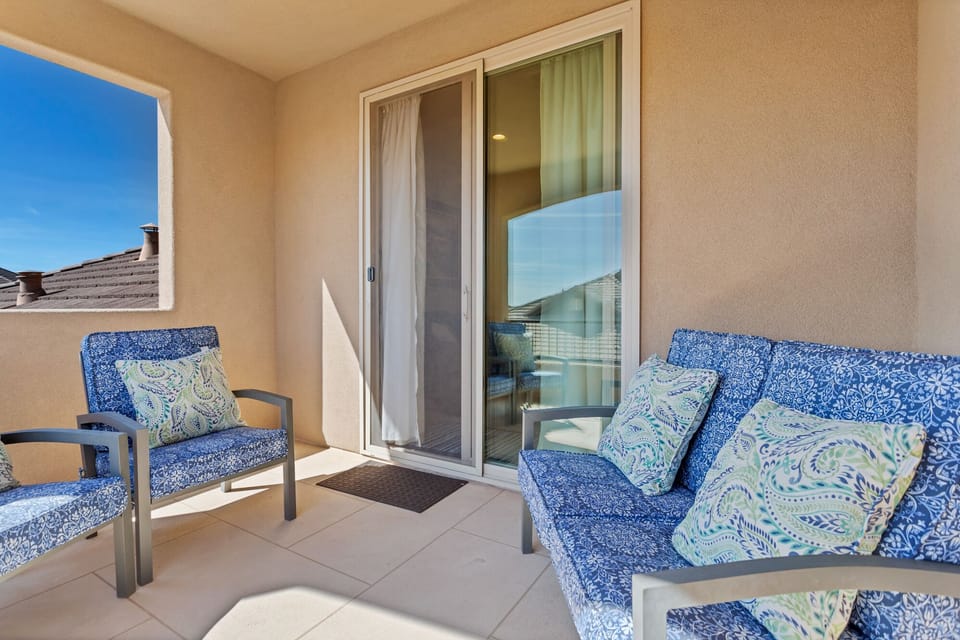 Second level family room balcony featuring extra seating