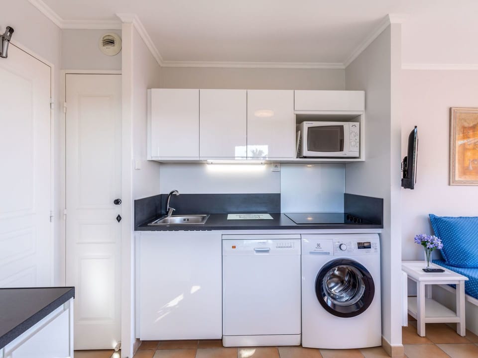 Room, Property, Furniture, Kitchen, Cabinetry, Major Appliance, Laundry Room, Interior Design, House, Building