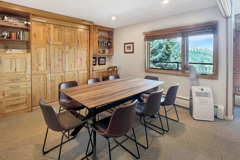 The dining area has a pull-down queen murphy bed and en-suite bath providing an extra sleeping space for your group.