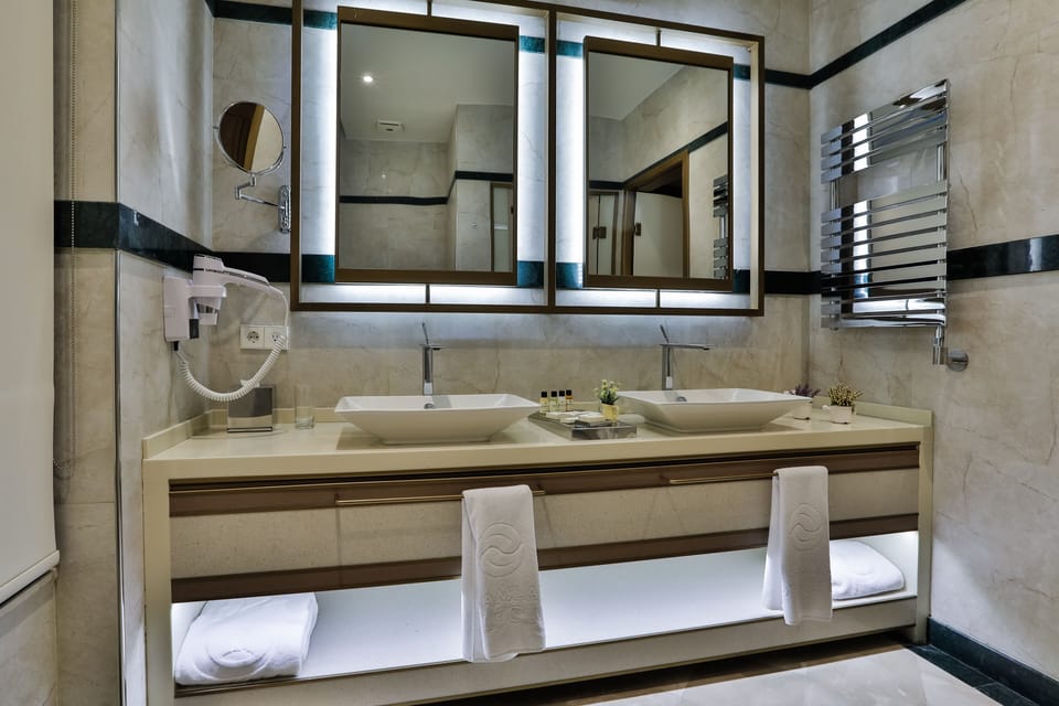 Shower, rainfall showerhead, designer toiletries, hair dryer