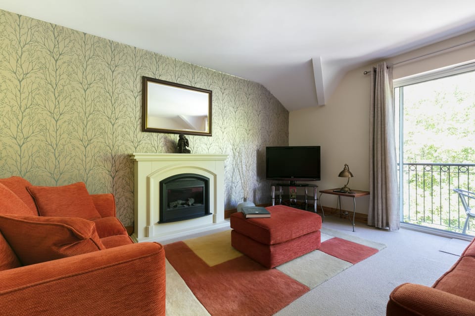 large living area,with beautiful fireplace,and balcony.