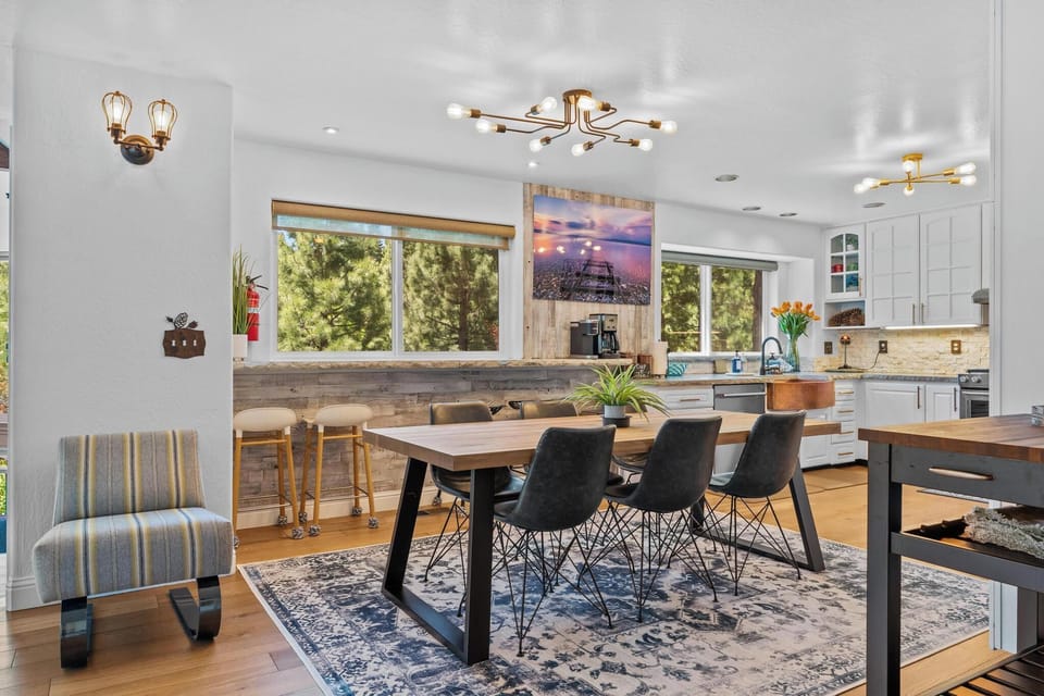 Dining area with bar top can seat 6-8 at table and 4 on bar top overlooking beautifully landscaped yard.