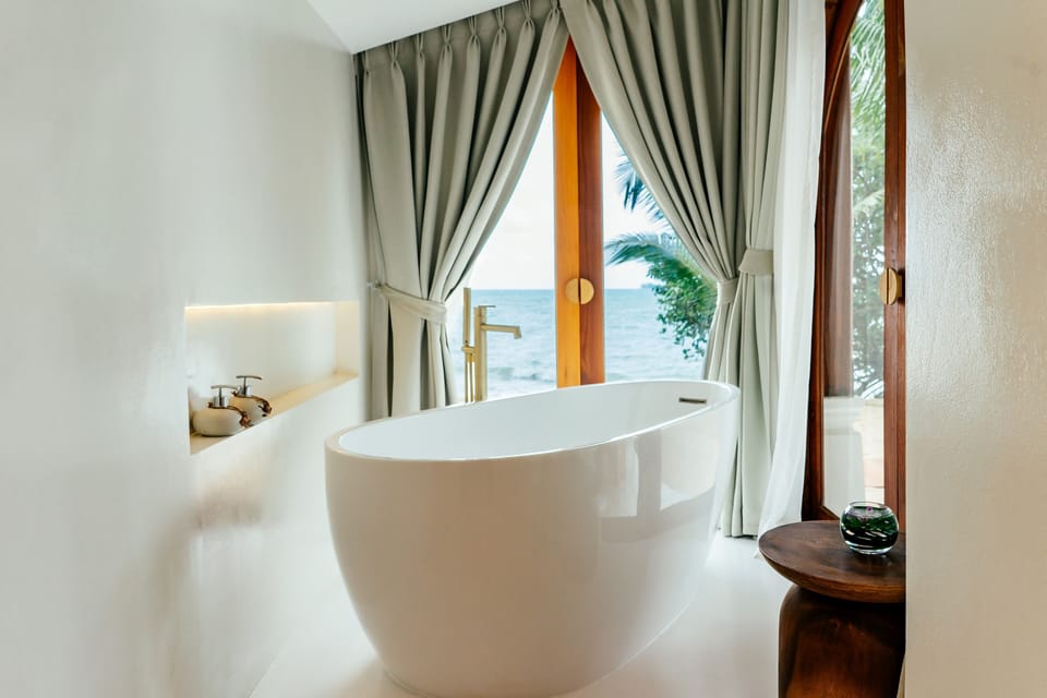 Junior Suite, Beachfront | Bathroom amenities | Shower, free toiletries, hair dryer, bathrobes