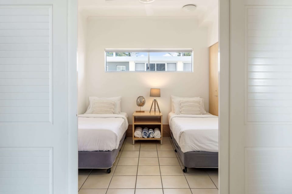 Twin bedroom with ceiling fan, ducted air conditioning and built in wardrobe