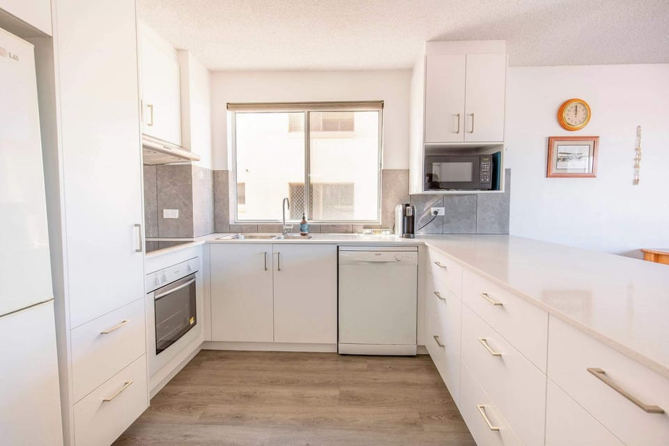 Fully equipped kitchen with modern appliances.