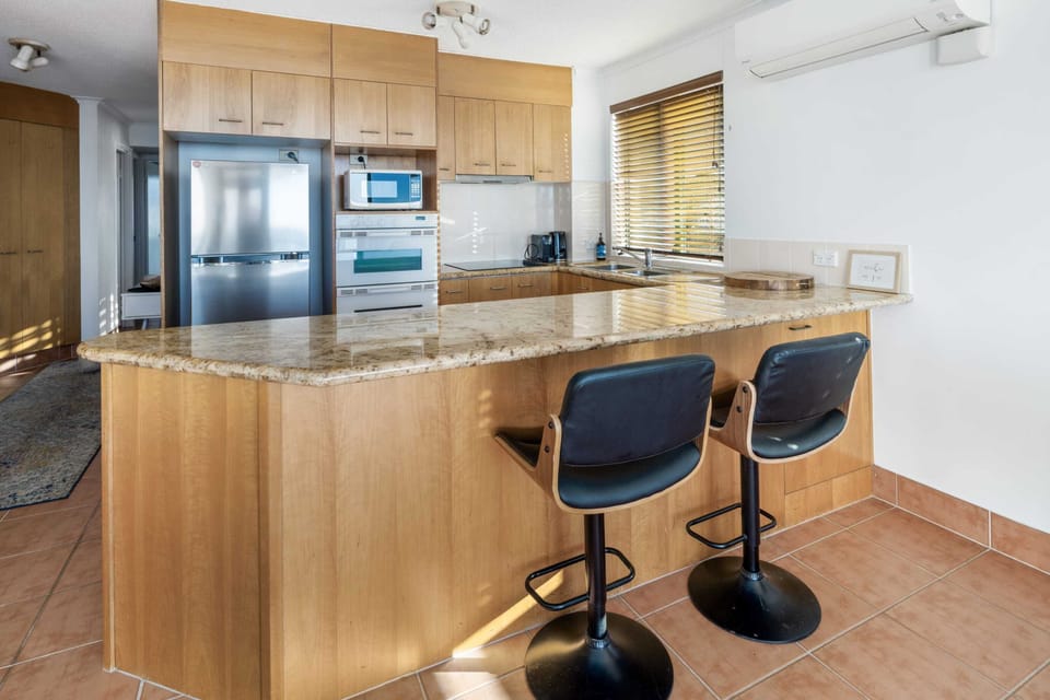 Open plan kitchen, living, and dining space.