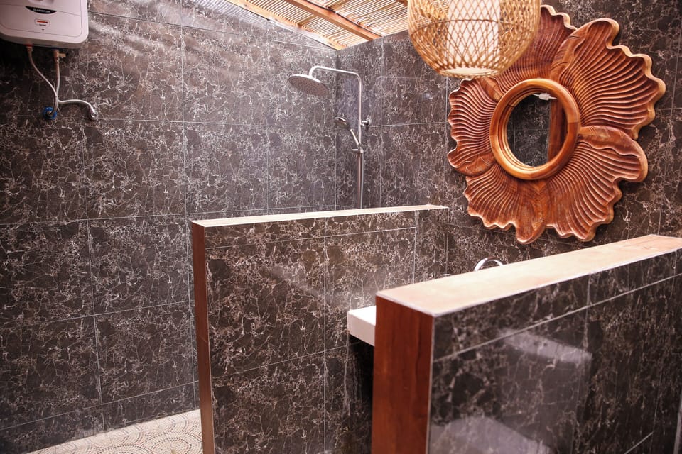 Shower, rainfall showerhead, slippers, towels