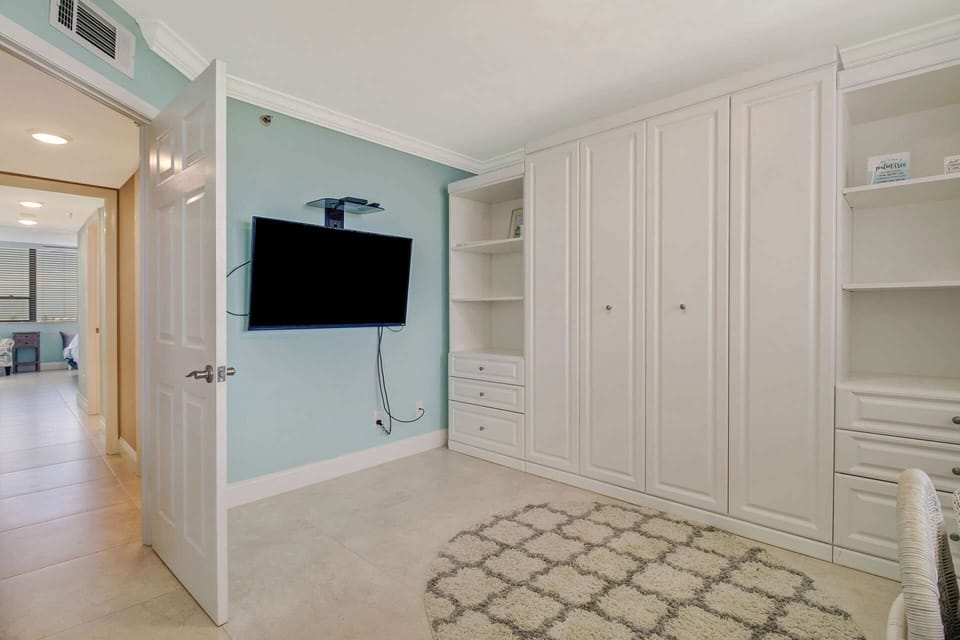 With the Murphy Bed up, the bedroom space can be used as a den/office, should you need to keep up with work back home.
