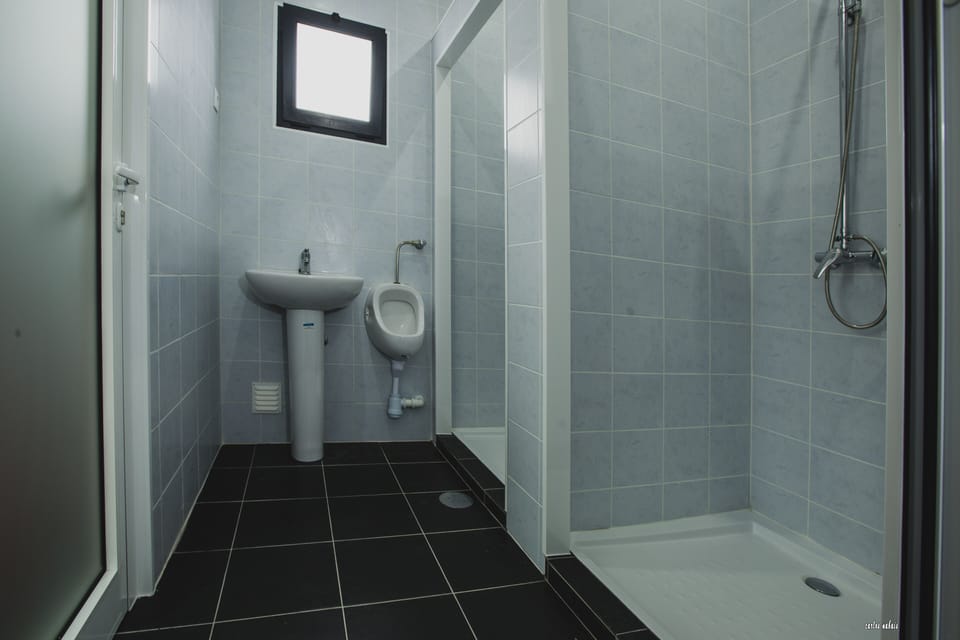 Shower, rainfall showerhead, towels, soap