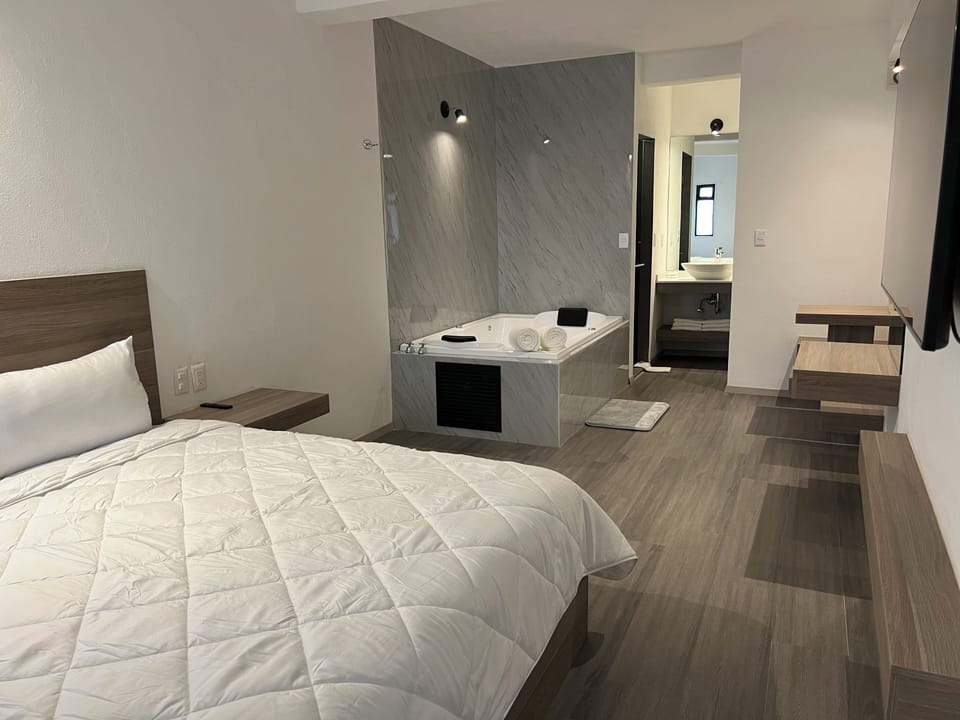 Luxury Room | Down comforters, pillowtop beds, desk, laptop workspace
