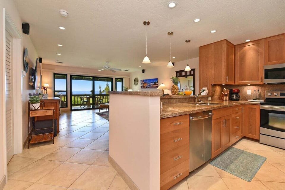 Open-concept kitchen with seamless flow into the living area and stunning ocean views beyond
