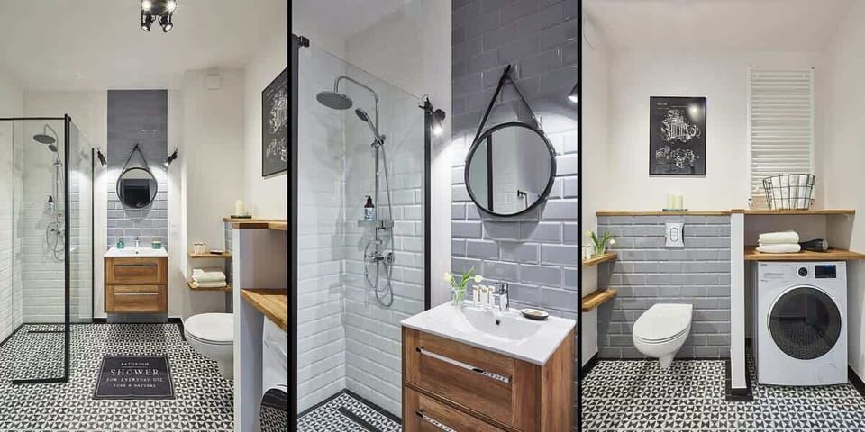 Bright bathroom with washing machine and shower cabin. 